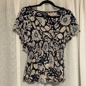 Angie wrap style blue floral top with cinched waist
